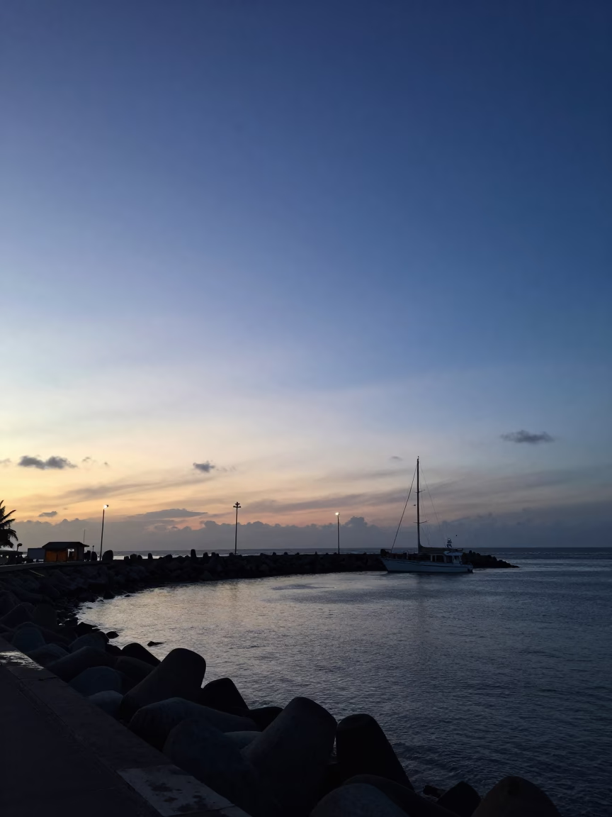 Predawn Durban Harbor Breakwater and Blue Hour Sky with Quiet Maritime Activity in in Durban, South Africa