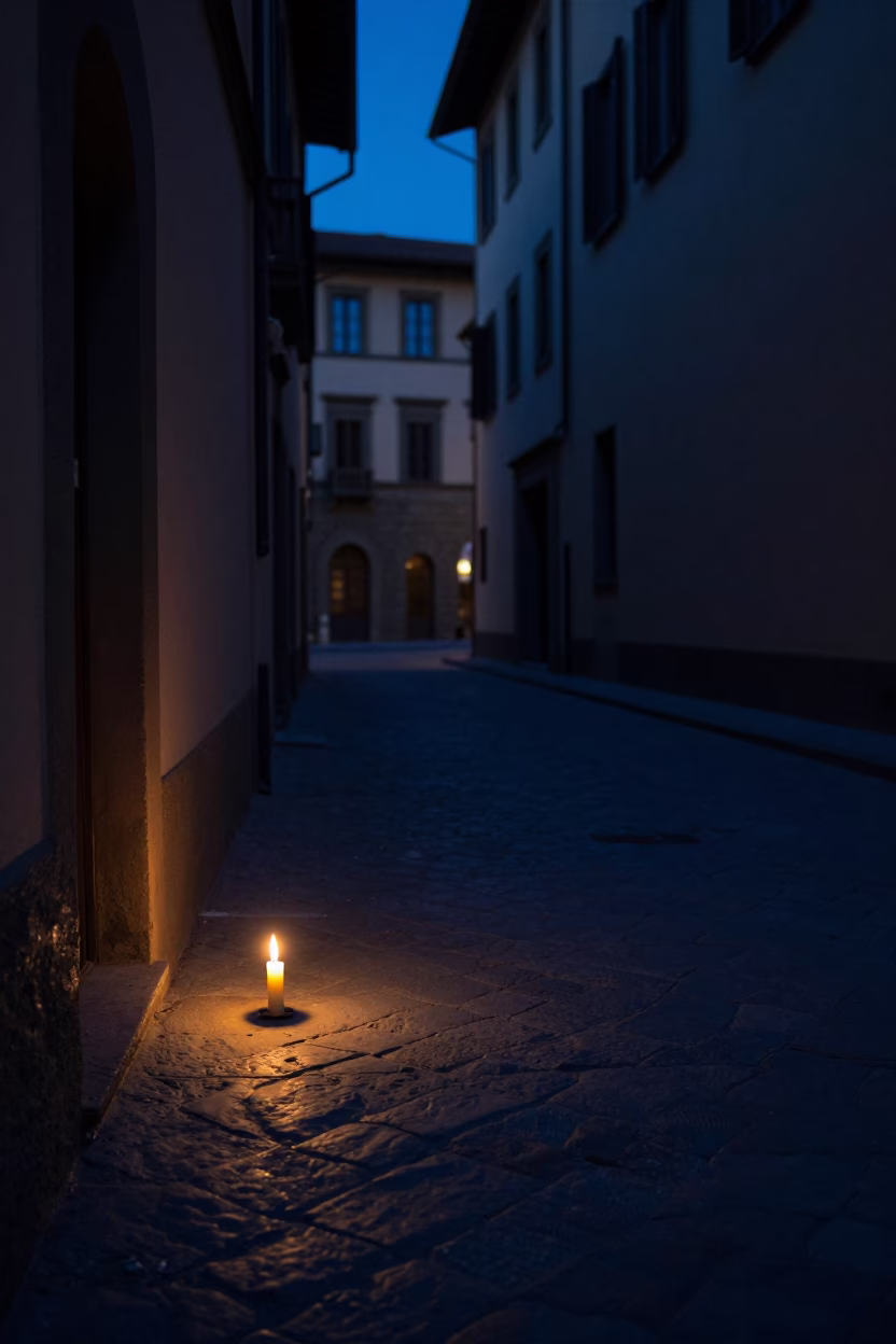 Predawn Florence Italy Street Scene with Taper Candle Illuminating Cobblestones in in Florence, Italy