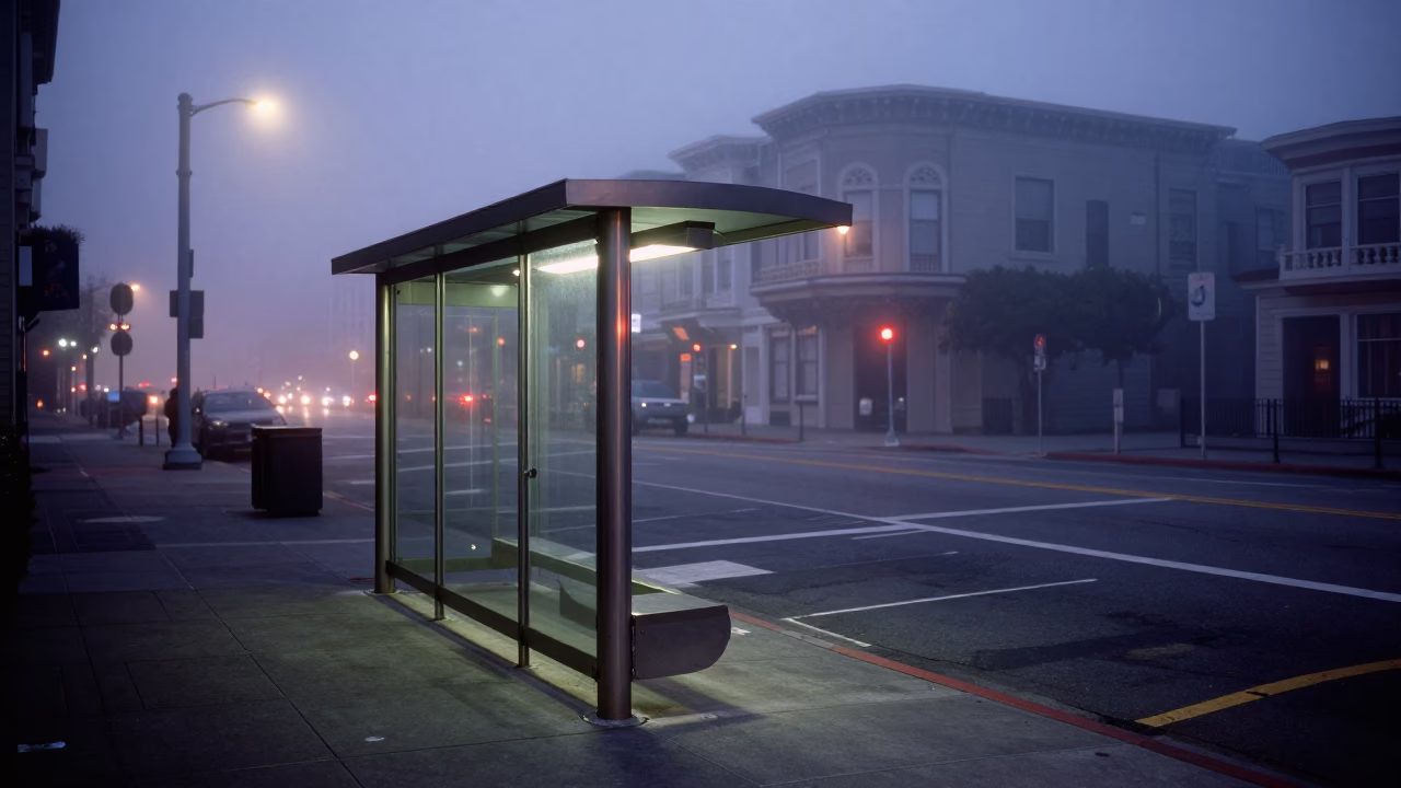 Predawn Fog Rolling Over San Francisco Street Corner With Brushed Steel Bus Shelter in in San Francisco, California, United States