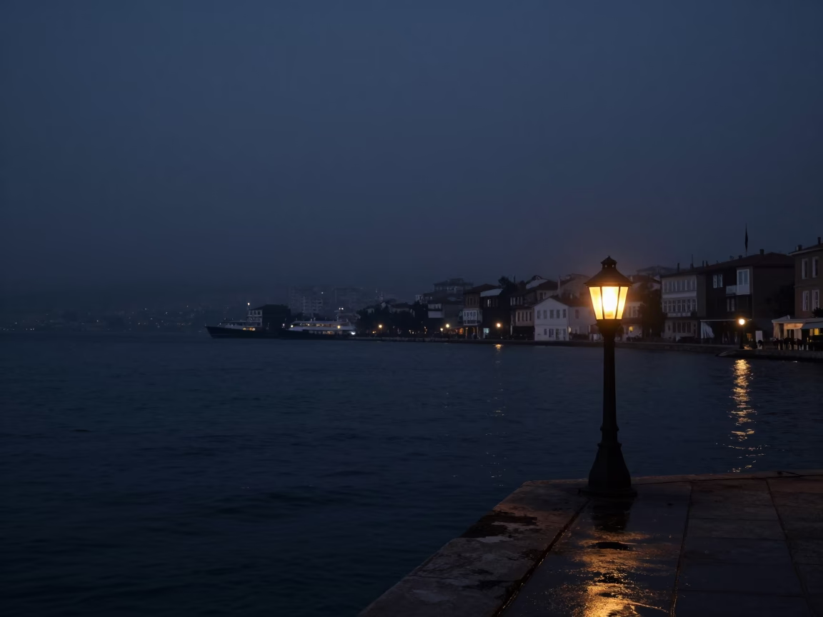 Predawn Harbor Scene in Izmir Turkey with Lantern Glow and Dark Water in in Izmir, Turkey