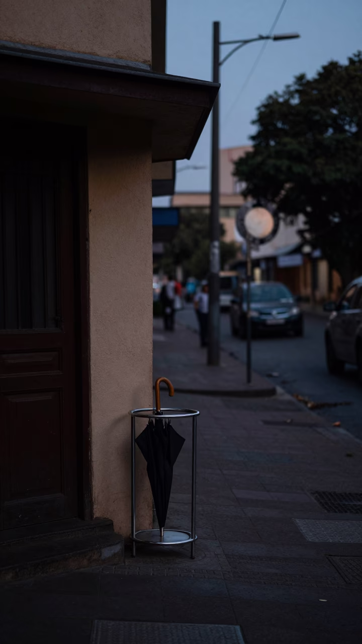 Predawn Johannesburg Street Scene with Umbrella Stand and Dim Red Lighting in in Johannesburg, South Africa