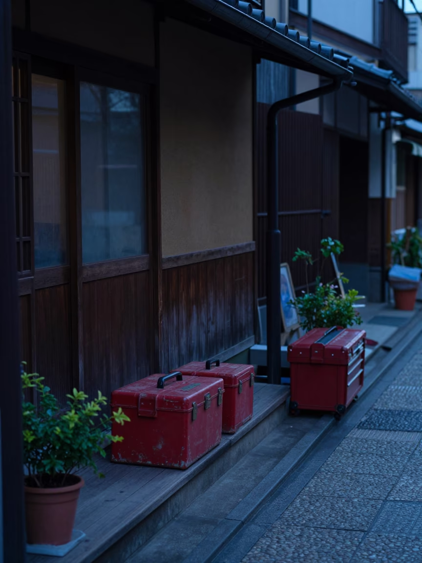 Predawn Kyoto Street Scene with Toolboxes and Potted Herbs Outside Traditional Shop in in Kyoto, Japan