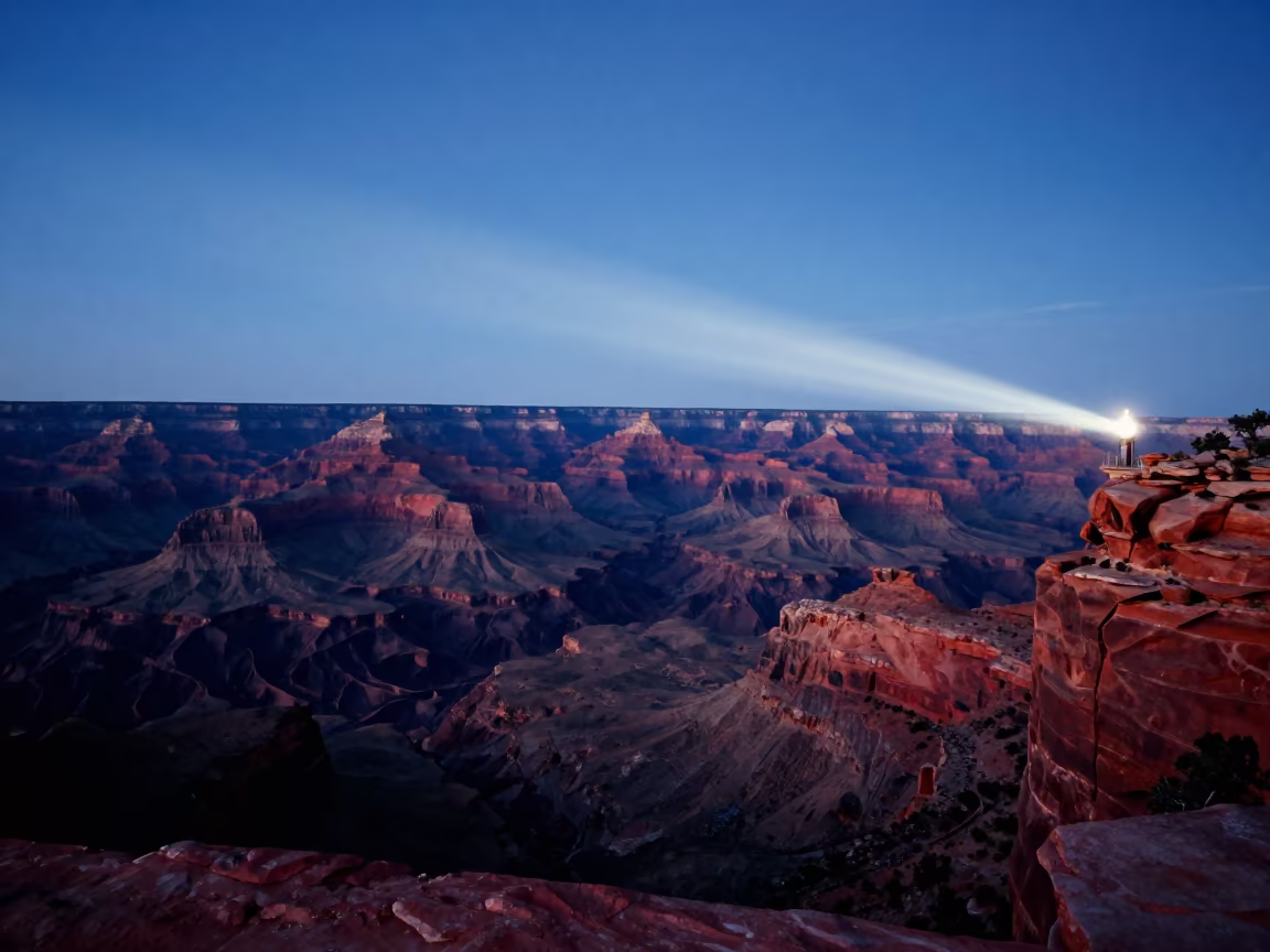 Predawn Lighthouse Sweep Across Red Arizona Canyon in across a floodplain after rain in Arizona