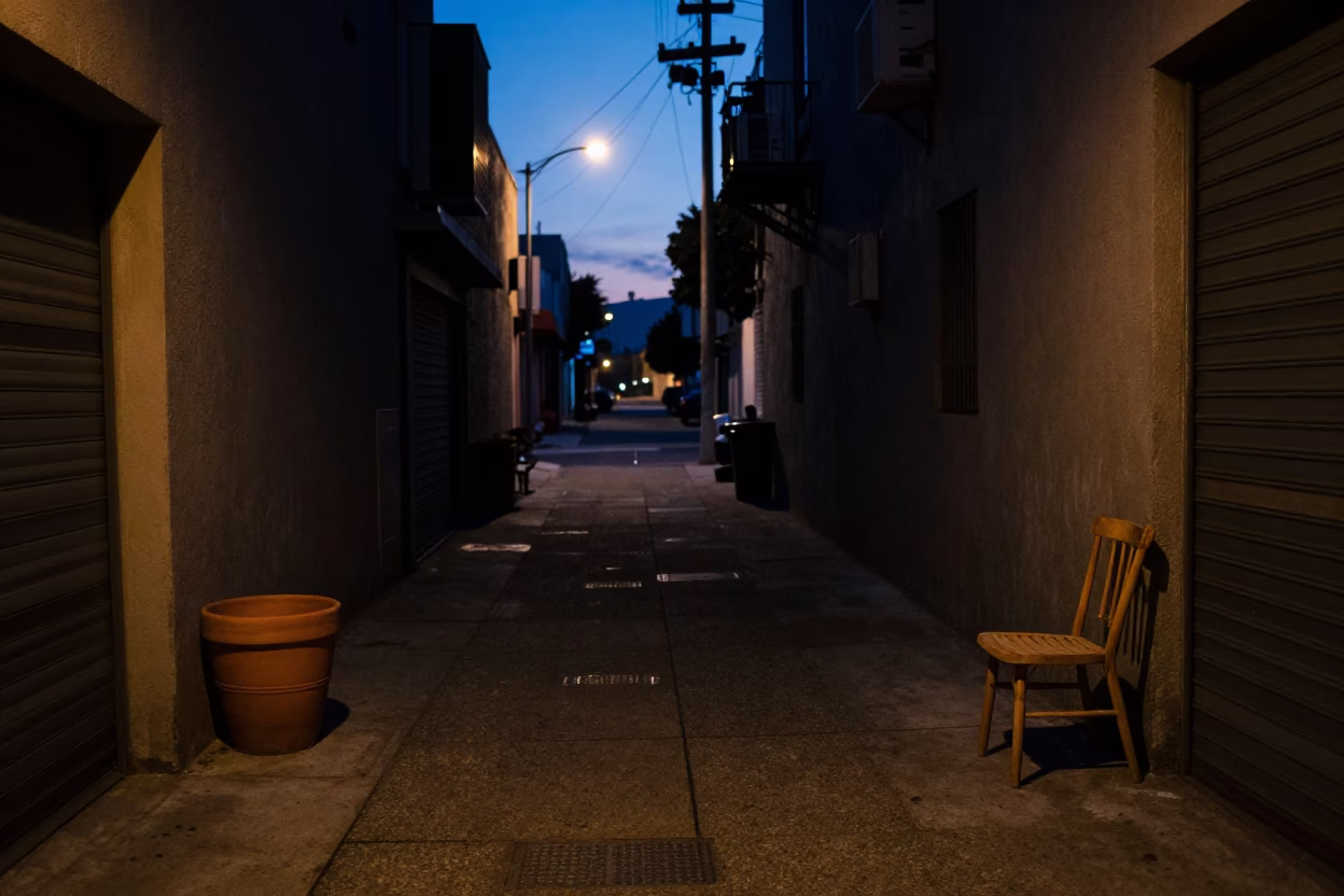 Predawn Los Angeles Street Scene with Terracotta Pot and Chair in Dark Urban Alley in in Los Angeles, California, United States