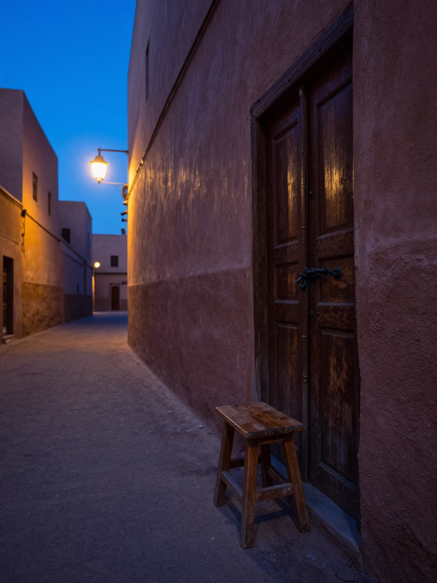 Predawn Marrakech Morocco Street Scene with Wooden Stool and Latch Shadow in in Marrakech, Morocco
