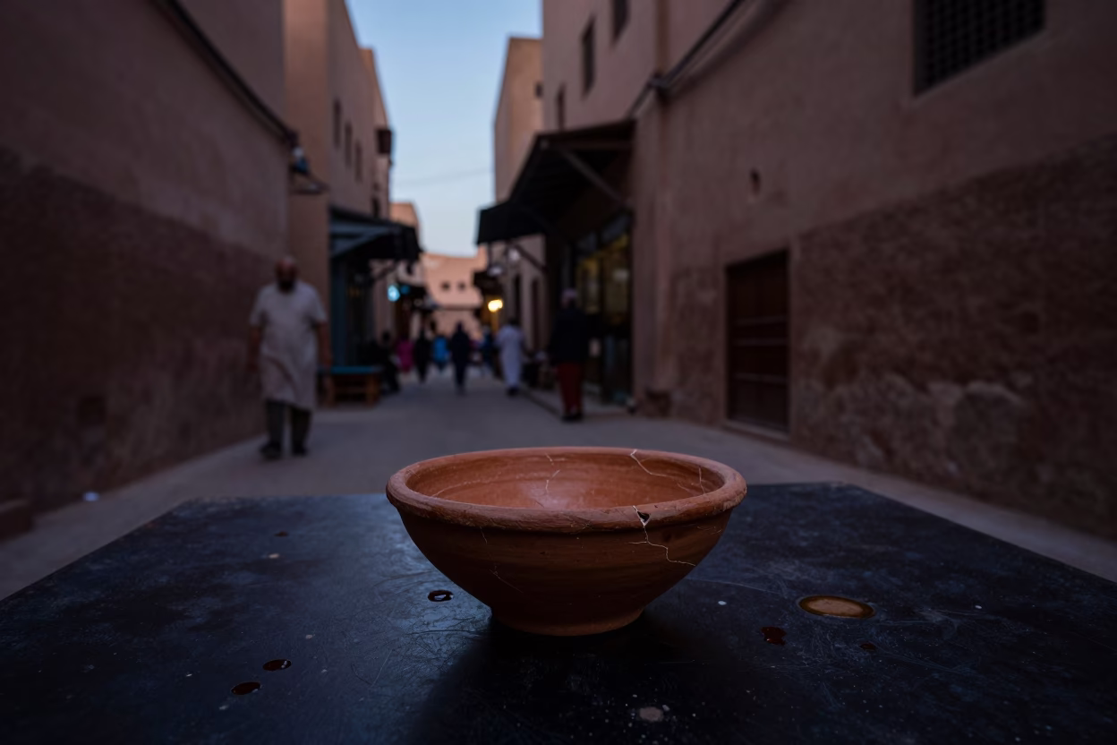 Predawn Marrakech Souk Street Scene with Terracotta Bowl and Tea Stains in in Marrakech, Morocco