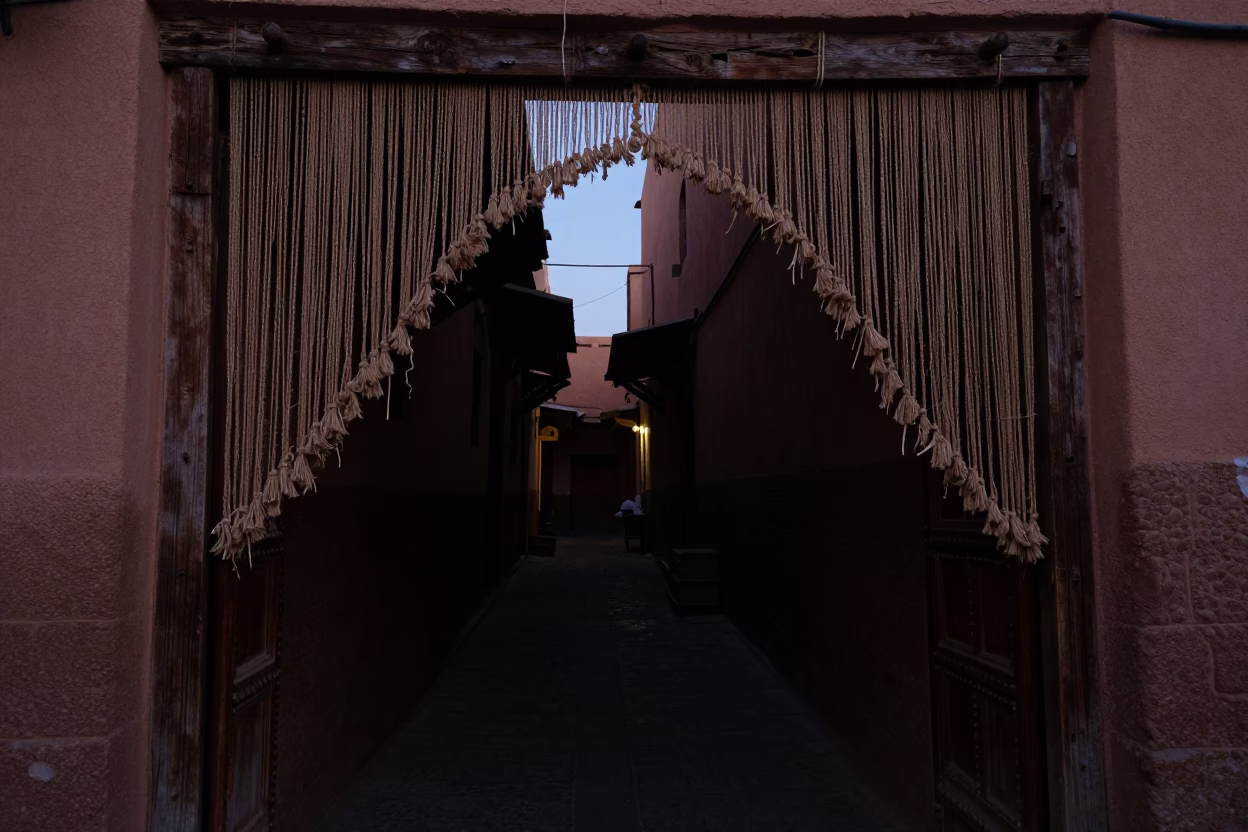 Predawn Marrakech Souk Street with Twine Fiber Doorframe and Anemone Flower Detail in in Marrakech, Morocco