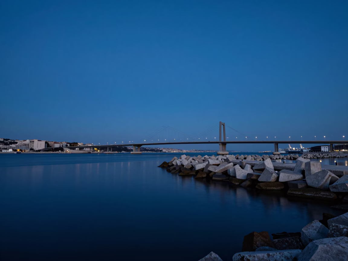 Predawn Marseille Harbor Breakwater Blue Hour Sky with Bridge Pier and Still Water Reflections in in Marseille, France