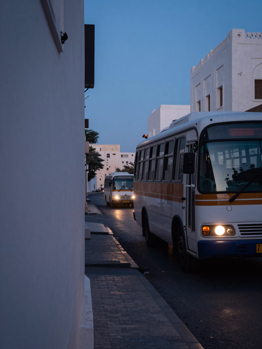 Predawn Muscat Street Scene with Classic Bus and Deadbolt Security Detail in in Muscat, Oman