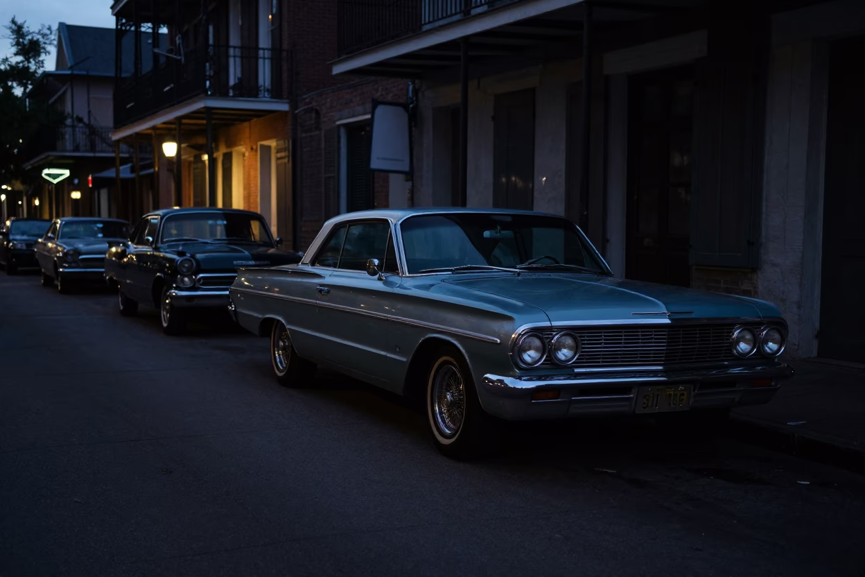 Predawn New Orleans Street Scene with Vintage Cars and Iron Balconies in Louisiana in in New Orleans, Louisiana, United States
