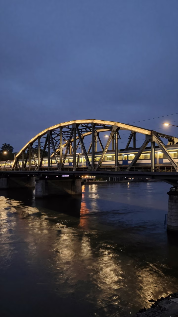 Predawn Night Train Crossing Floodlit Iron Bridge in Brussels Belgium in in Brussels, Belgium