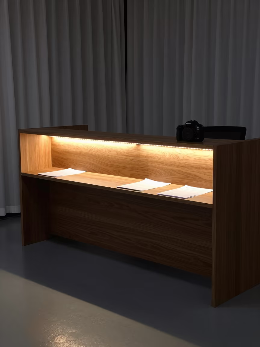 Predawn Office Riser Shelf with String Lights in at an office reception desk in Kokshetau