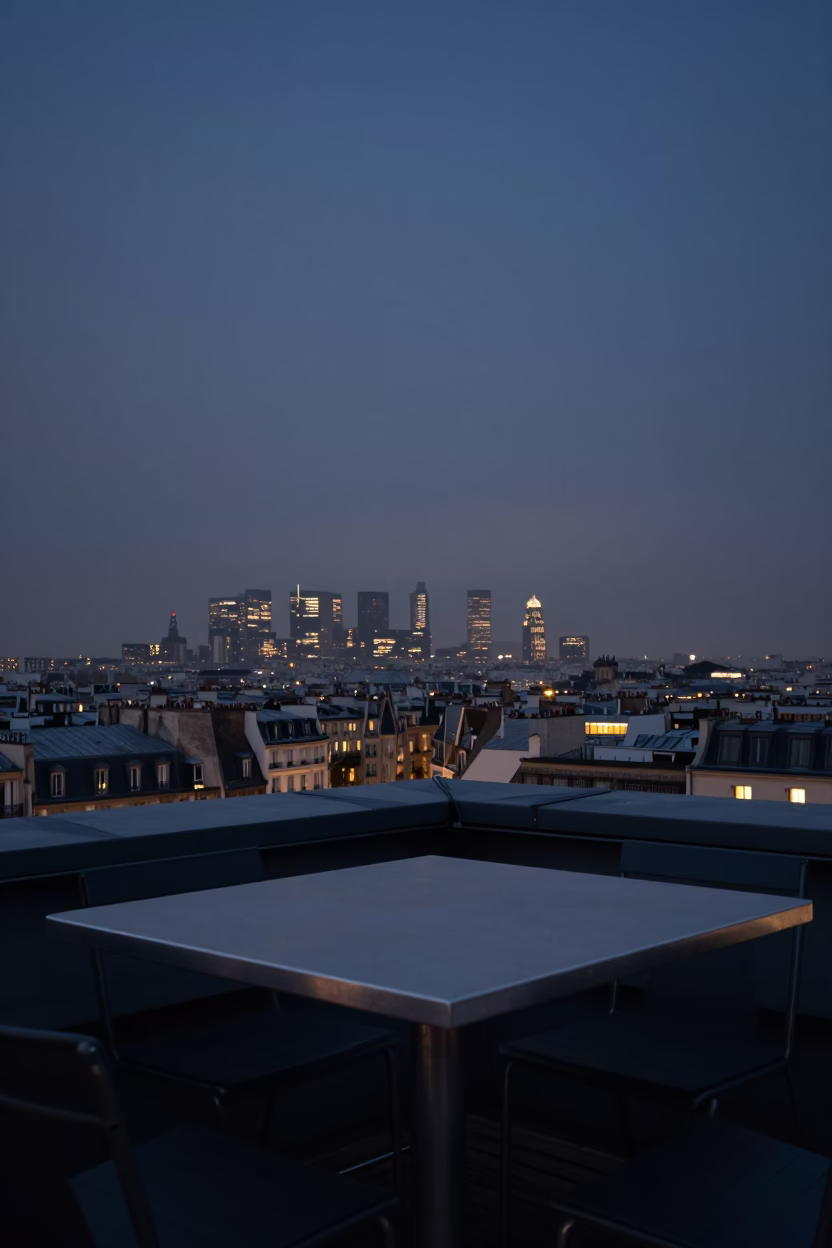 Predawn Paris Skyline View from Rooftop with Steel Table and Blue Porcelain Bowl in in Paris, France
