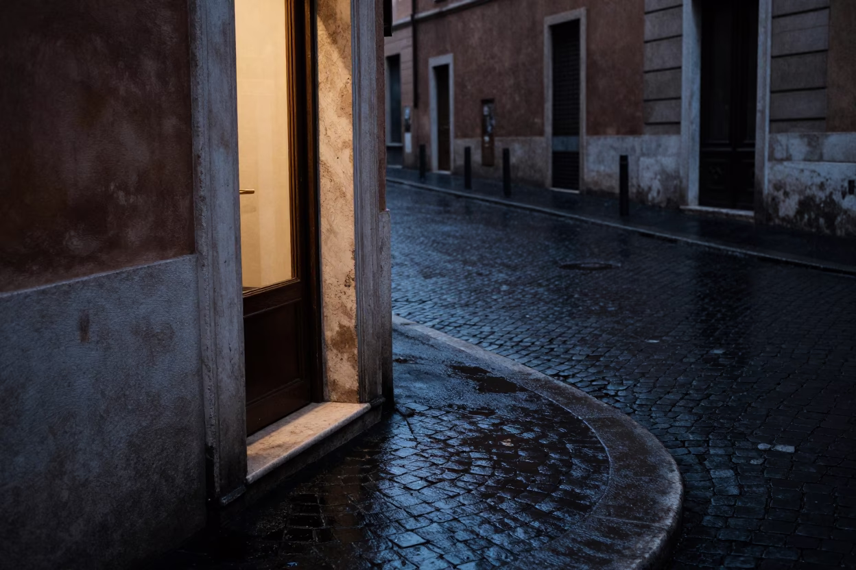 Predawn Rome Street Corner with Wet Pavement and Doorframe in in Rome, Italy