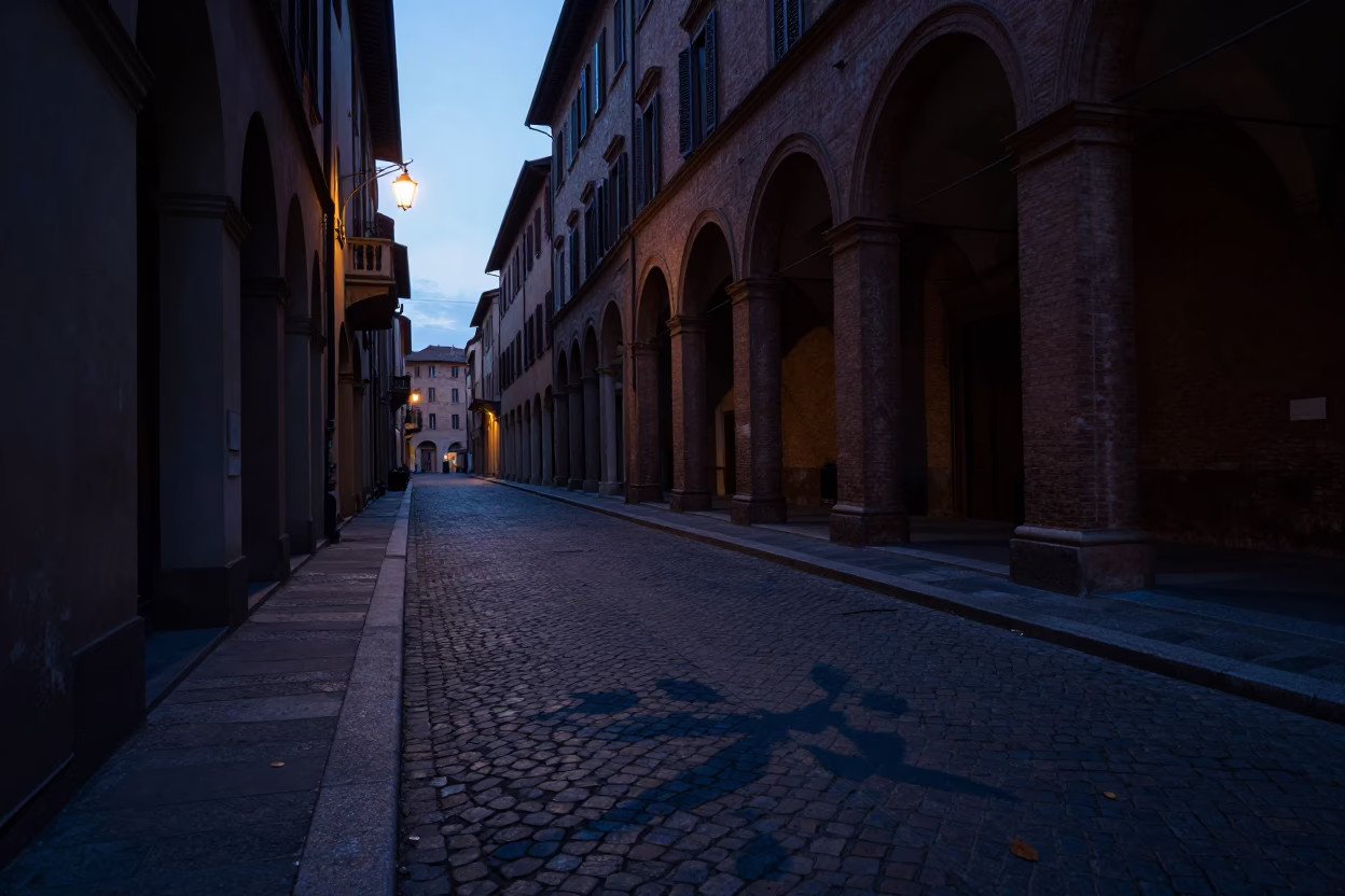 Predawn shadows and street details in historic Bologna Italy before sunrise in in Bologna, Italy