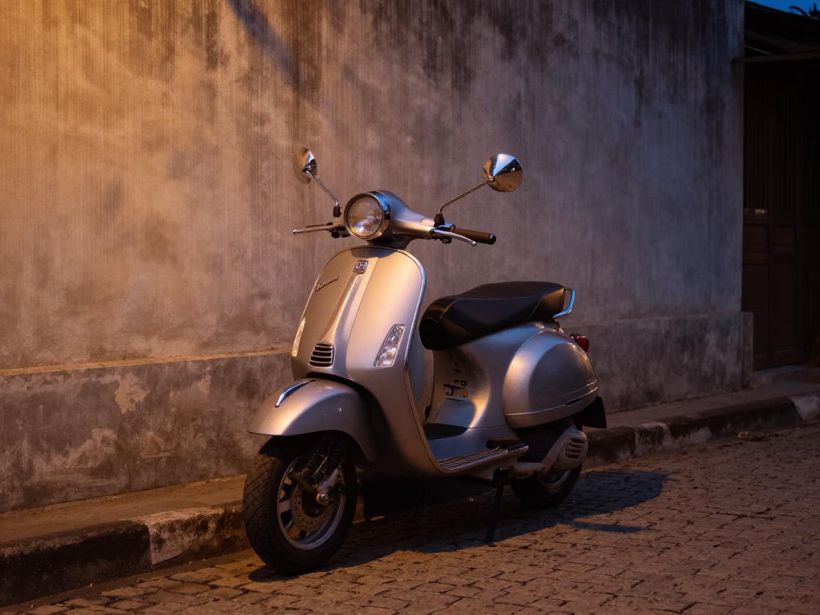 Predawn street scene in Chiang Mai Thailand with vintage Vespa on cobblestone lane in in Chiang Mai, Thailand