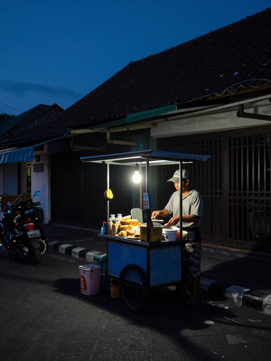 Predawn Street Scene in Denpasar Indonesia with Local Vendor and Early Morning Light in in Denpasar, Indonesia