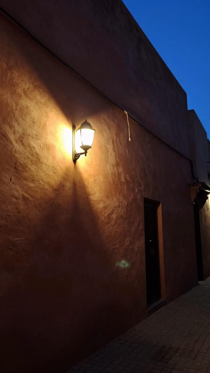 Predawn Street Scene in Marrakech Morocco with Wall Sconce and Twine in in Marrakech, Morocco