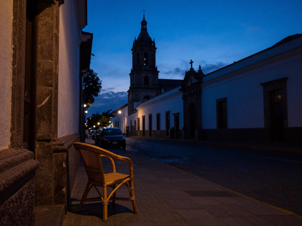 Predawn Street Scene in Quito Ecuador with Rattan Chair and Urban Shadows in in Quito, Ecuador