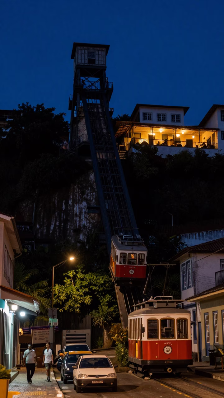 Predawn Street Scene in Salvador Brazil with Funicular Car Approaching Cliffside Restaurant in in Salvador, Brazil