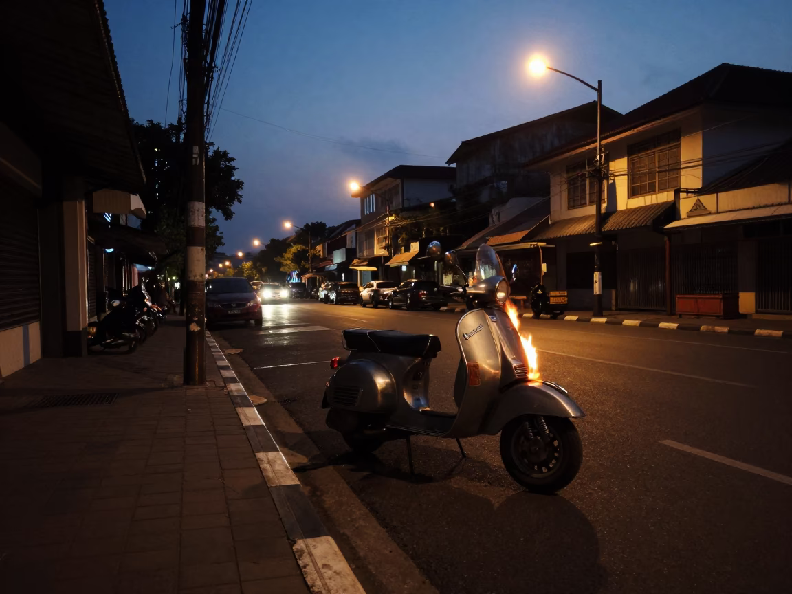 Predawn Street Scene in Surabaya Indonesia with Vintage Vespa and Flame Tree in in Surabaya, Indonesia