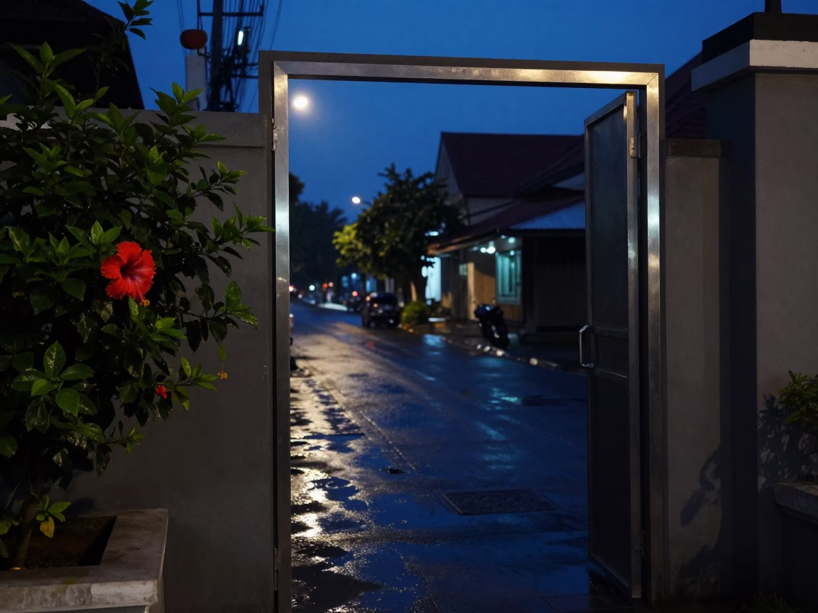 Predawn Street Scene in Yogyakarta Indonesia with Metal Doorframe and Hibiscus Flower in in Yogyakarta, Indonesia