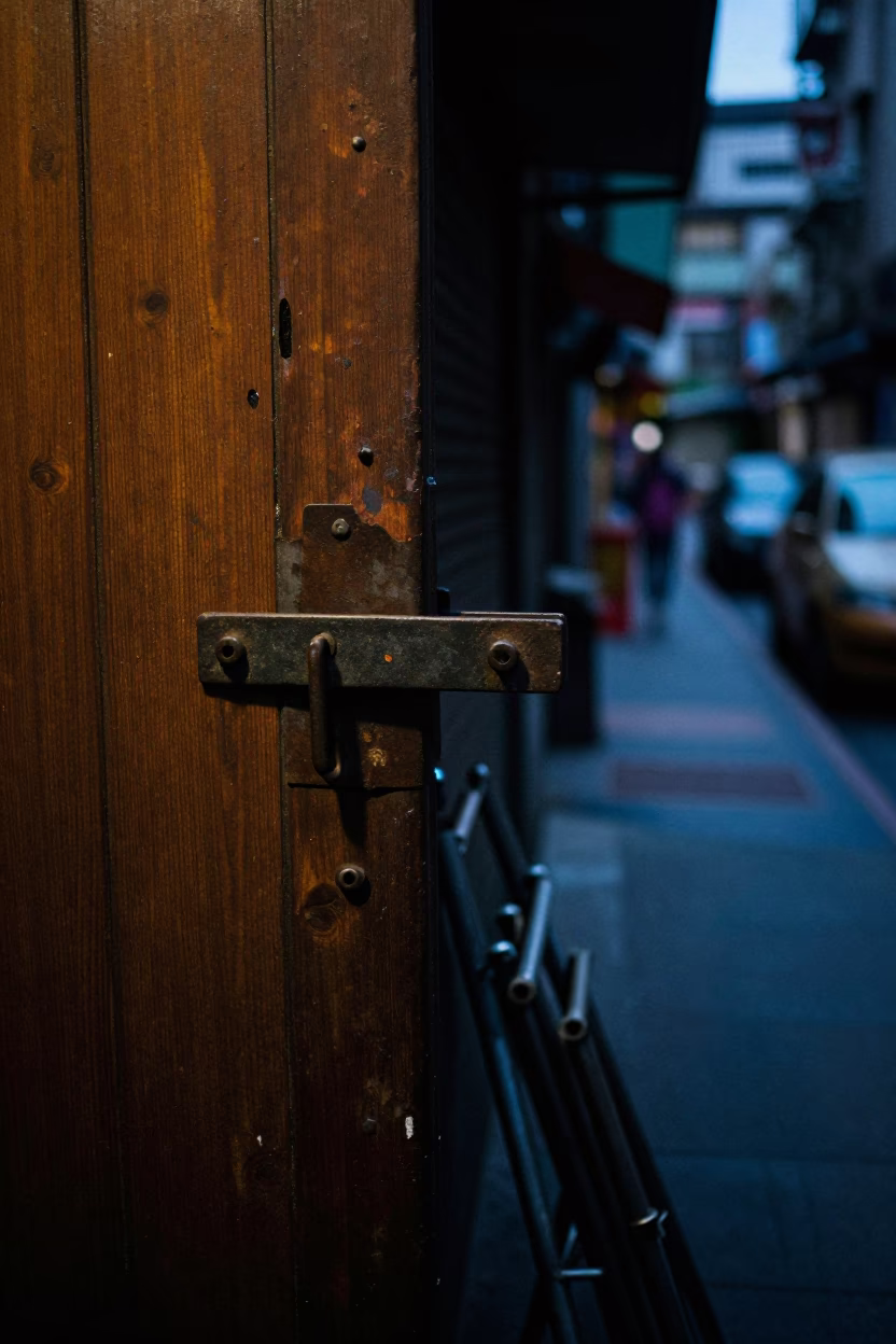 Predawn Taipei Street Scene with Iron Deadbolt and Folding Chair in in Taipei, Taiwan