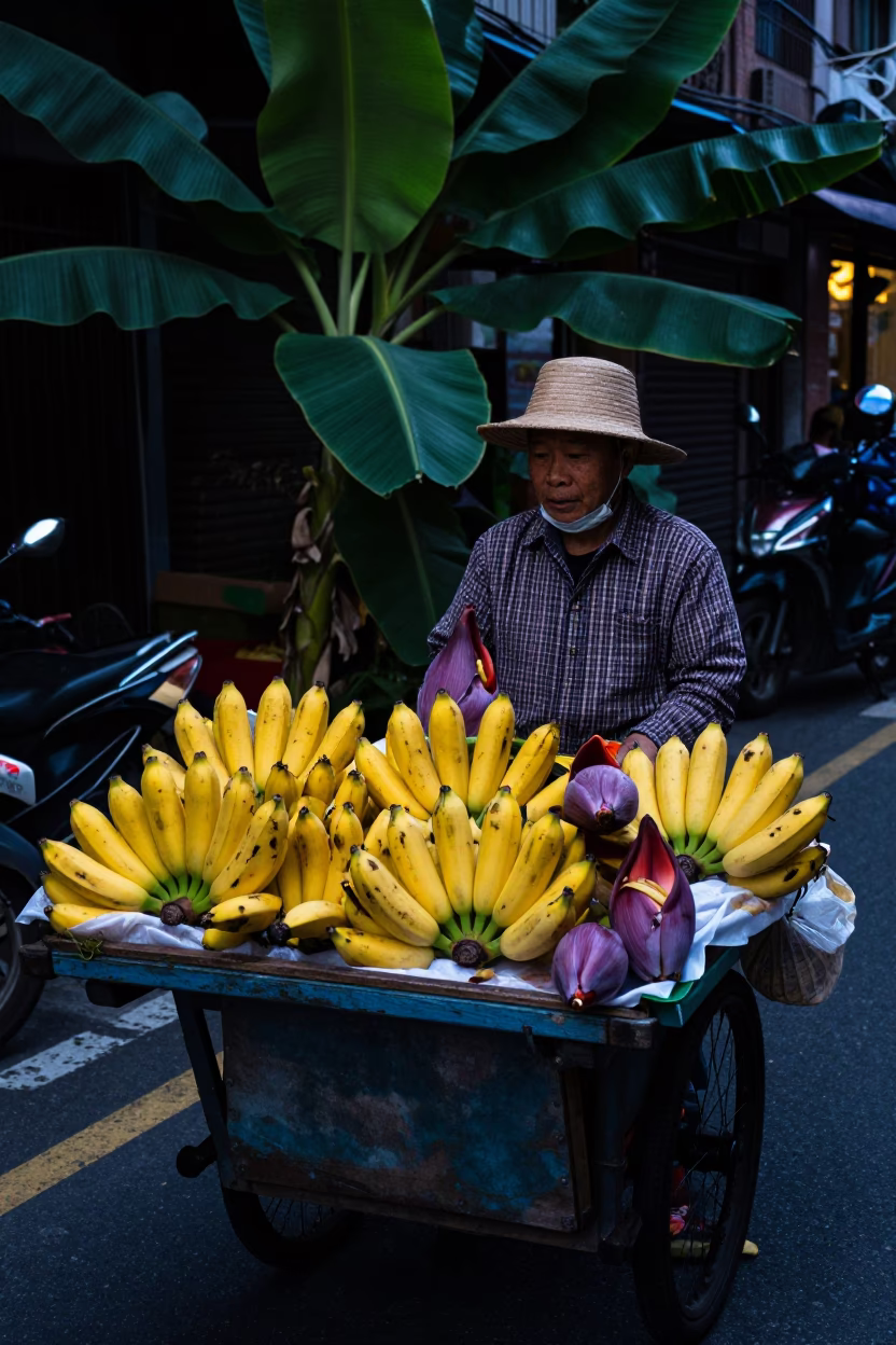 Predawn Taipei street vendor selling banana and banana flower in traditional market in in Taipei, Taiwan