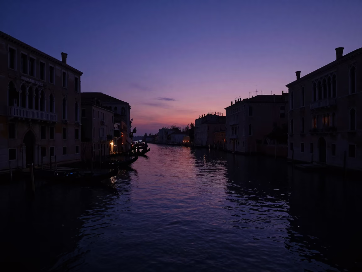 Predawn Venice Canal Reflections and Silhouetted Gondolas in Dark Early Morning Light in in Venice, Italy