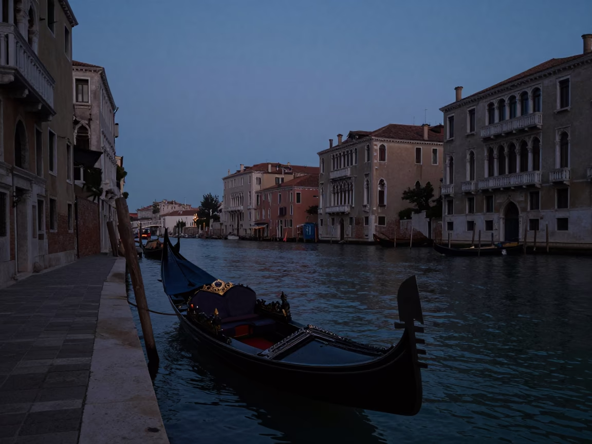Predawn Venice Canal View with Traditional Gondola Moored Near Historic Brick Buildings in in Venice, Italy
