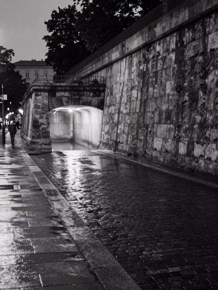 Predawn Vienna Street Scene with Dam Spillway Water Reflection and Urban Tunnel Portal in in Vienna, Austria