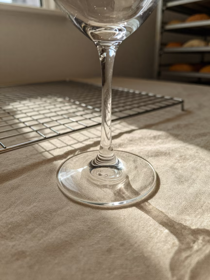 Prism of Light Through Wine Glass on Linen in on a bakery cooling rack in Salem