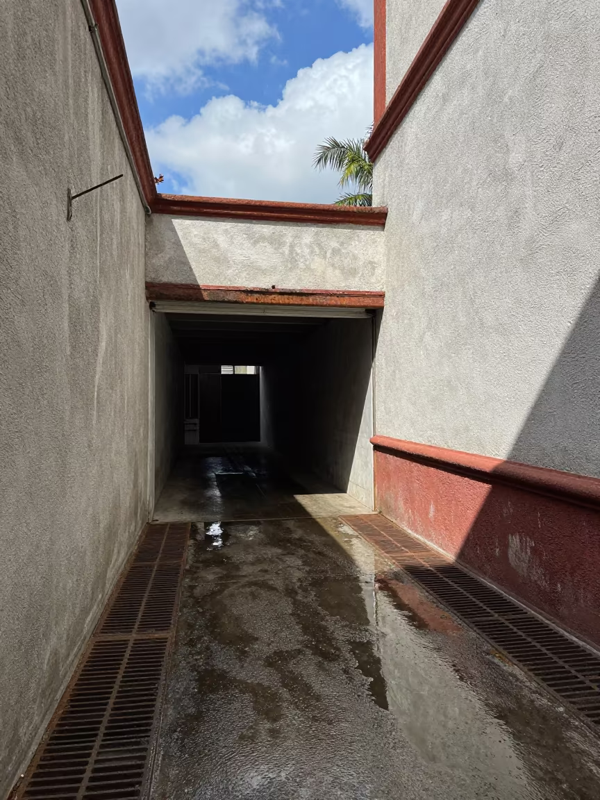Puebla Alley Puddle Sky Reflection in outside a metro entrance in Puebla