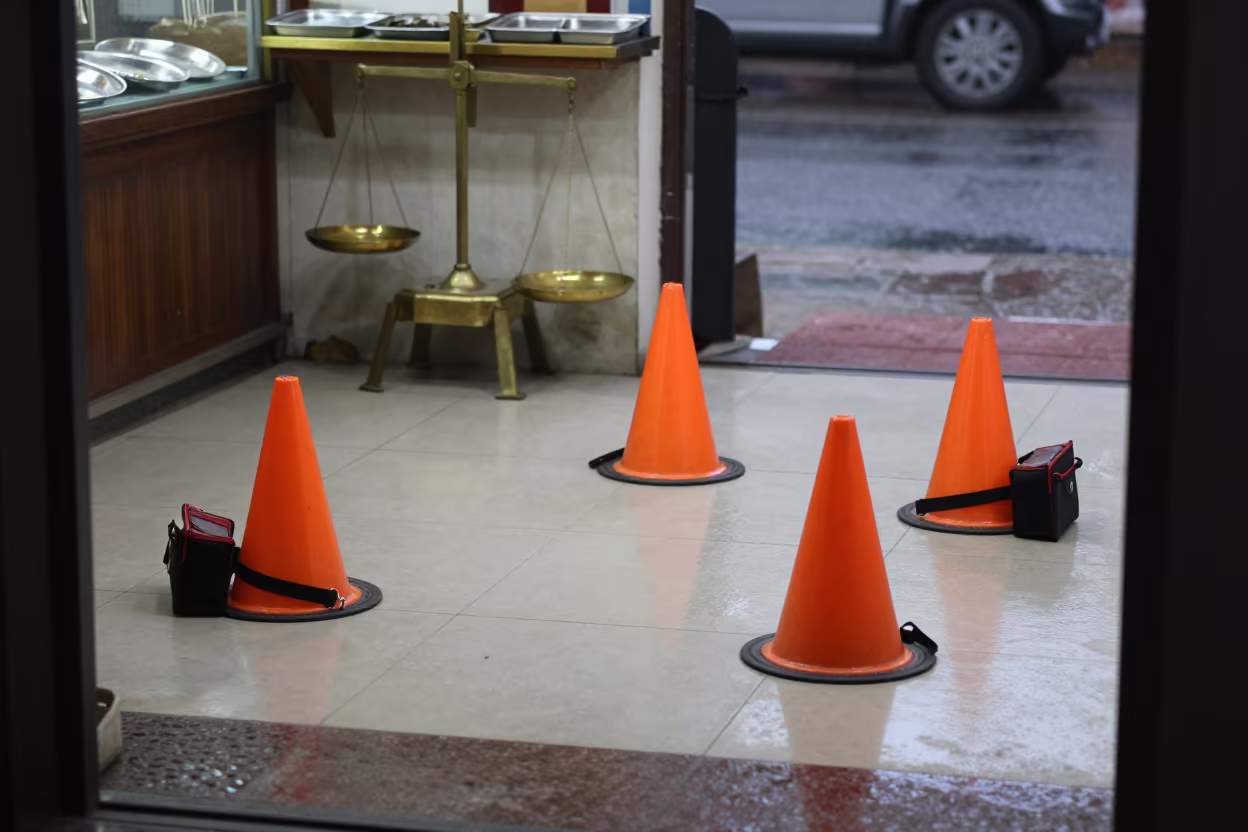 Puppy Training Ring Before Opening in inside a jeweler's stall with brass scales and trays near Ahmedabad