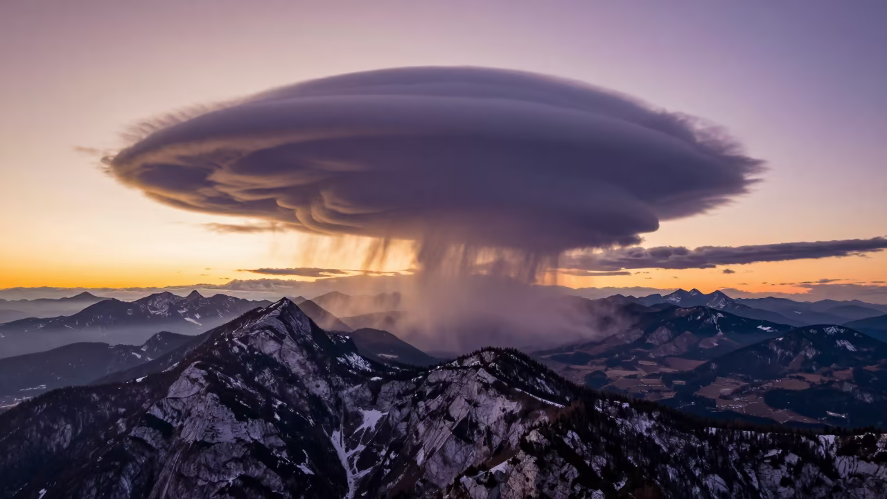 Purple Gold Mammatus Clouds Winter Sunset Slovenia in over a horizon of stacked thunderheads in Slovenia