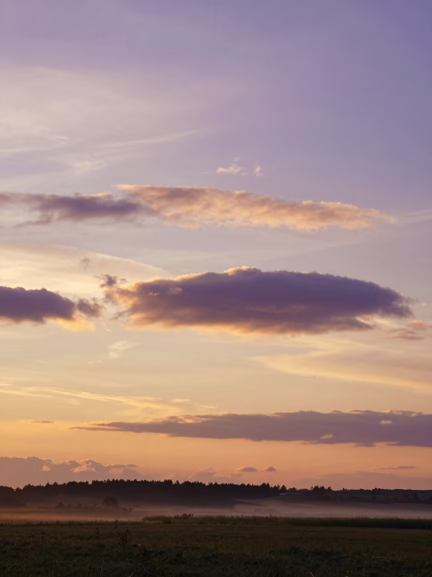 Purple Mammatus Clouds Over Ukraine at Sunset in beneath fast-moving cloud bands in Ukraine