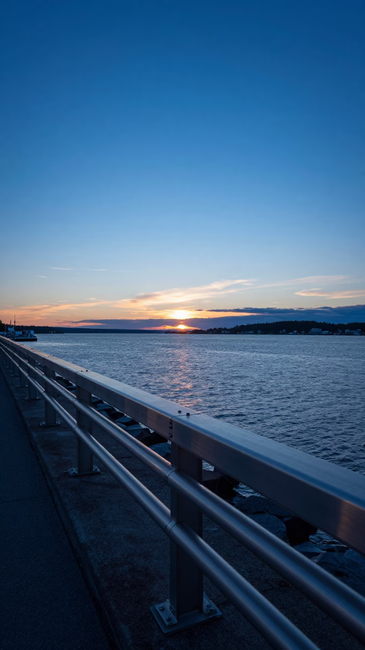 Quebec City Harbor Breakwater at Blue Hour with Brushed Steel Rail and Water Ripples in in Quebec City, Quebec, Canada