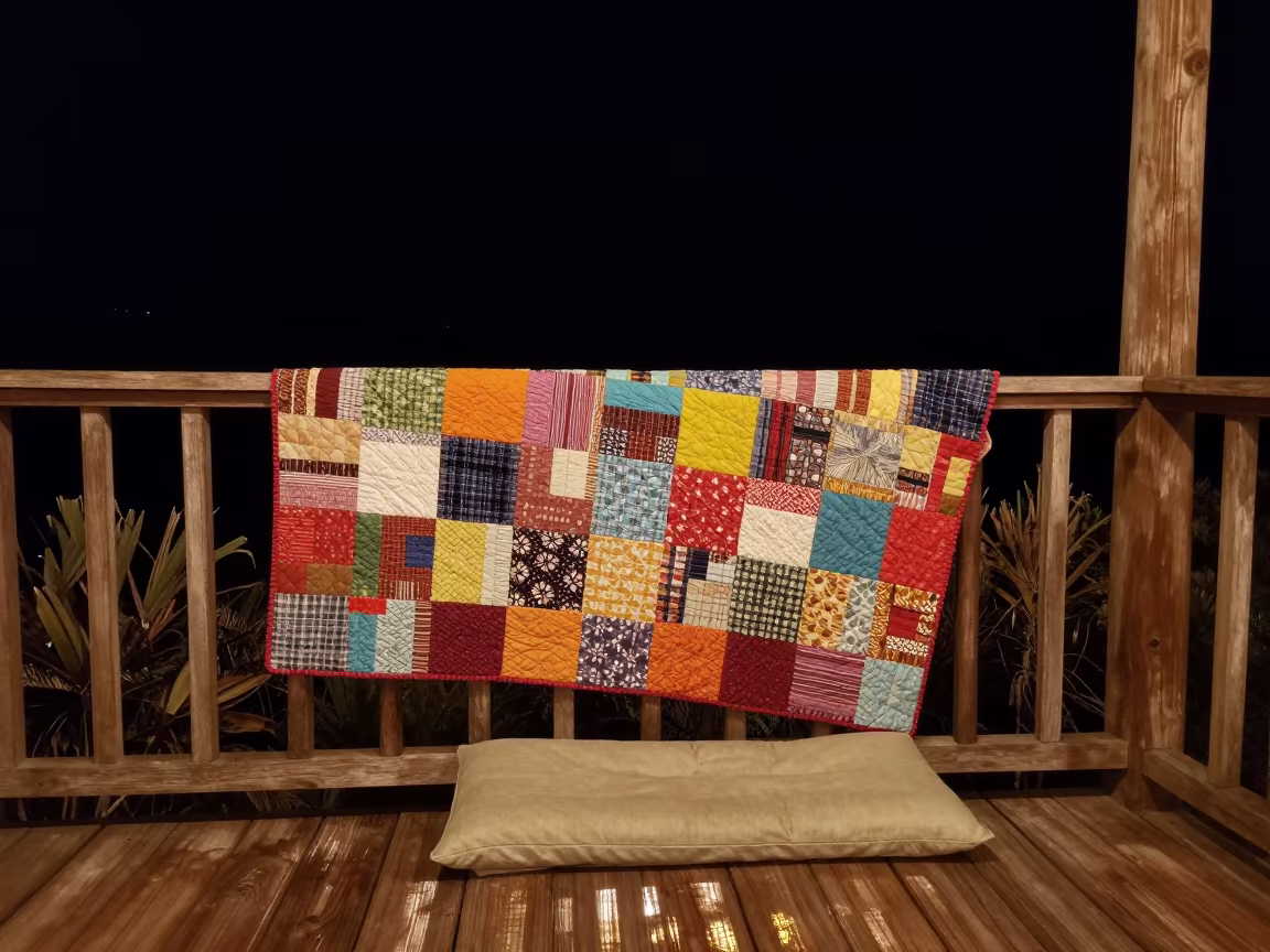 Quilt Airing on Porch Railing Under Night Sky in on a reading nook cushion in Puerto La Cruz