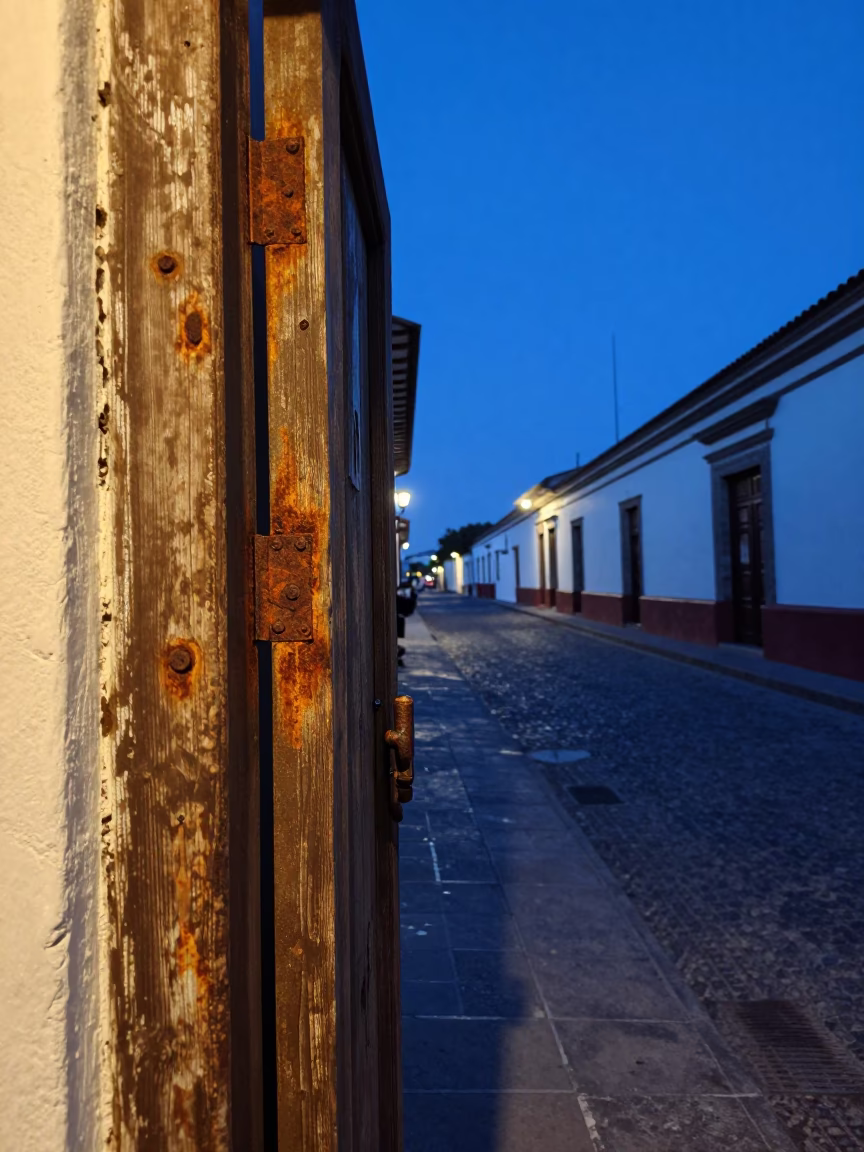 Quito Ecuador Evening Blue Hour Street Scene with Rusty Doorframe and Drying Laundry in in Quito, Ecuador