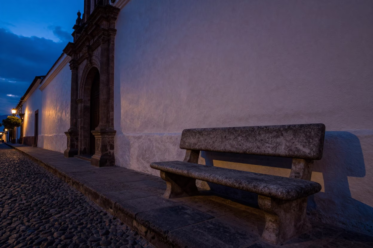 Quito Ecuador Indigo Twilight Street Scene with Stone Bench and Local Life in in Quito, Ecuador
