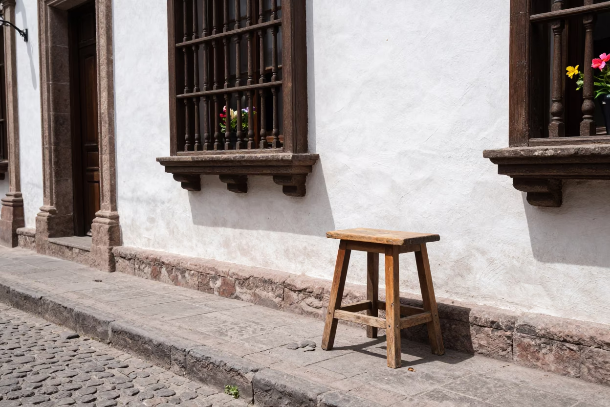 Quito Ecuador Midday Street Scene with Kitchen Stool and Flowering Plant in in Quito, Ecuador
