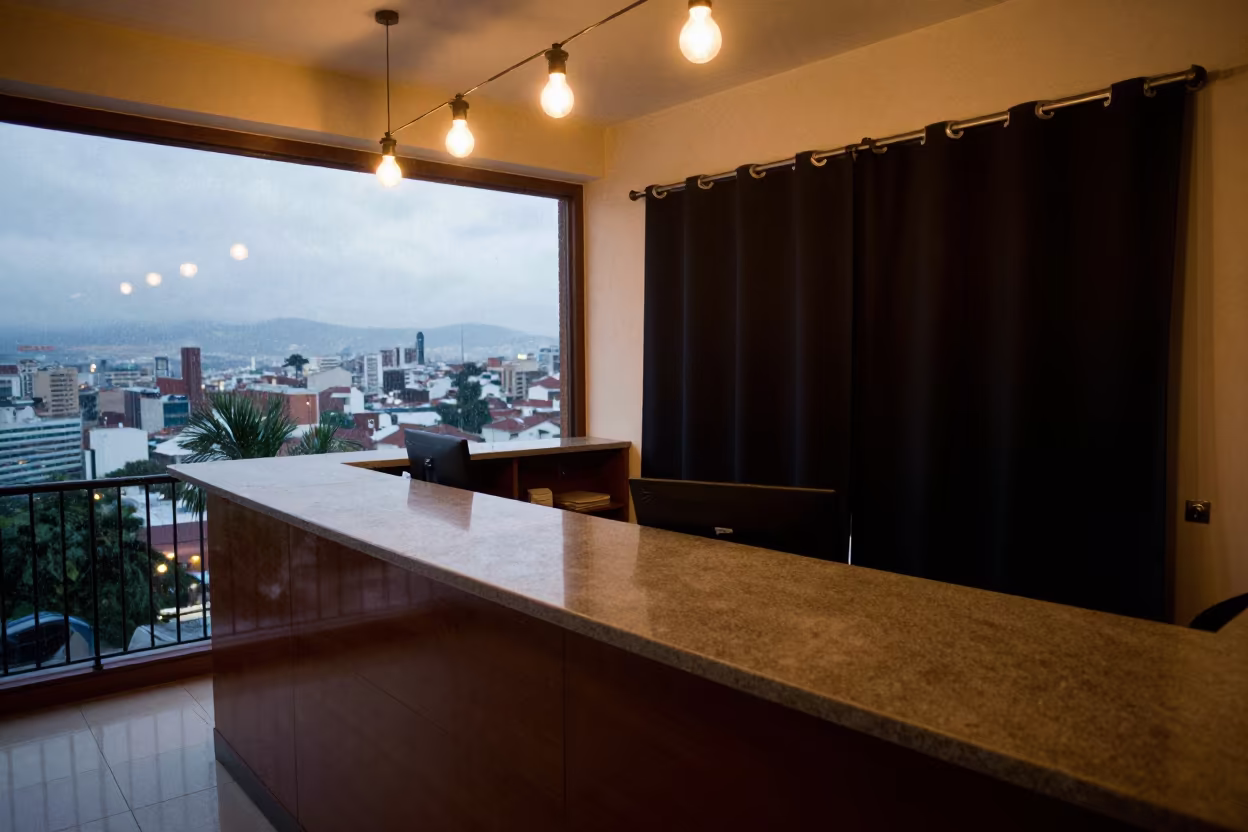 Quito Hotel Reception Desk Curtain Hook Kit in at a reception desk under warm light in Quito