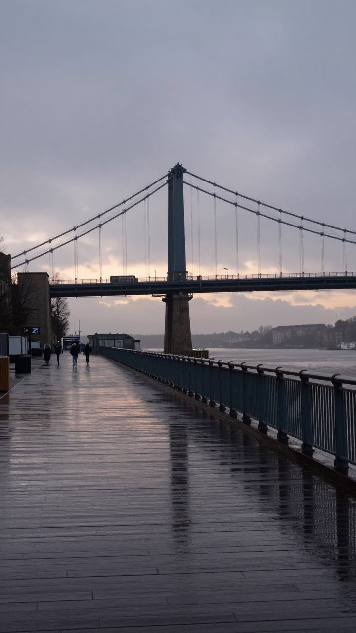 Rain-slicked Bristol Harbour Bridge deck at dawn with wet reflections in in Bristol, United Kingdom