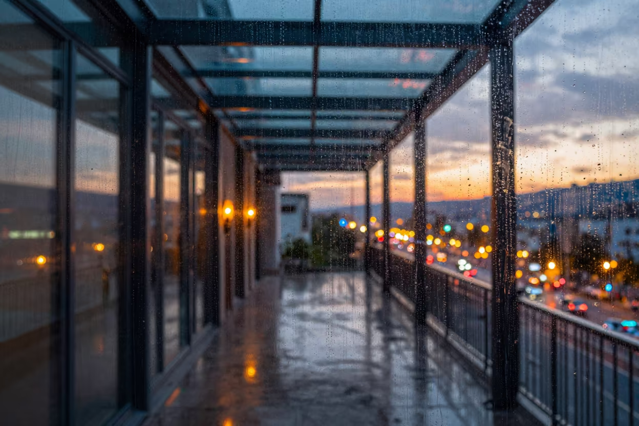 Rain Streaks Over Neon Cityscape Iğdır in inside a skylit passageway near Iğdır