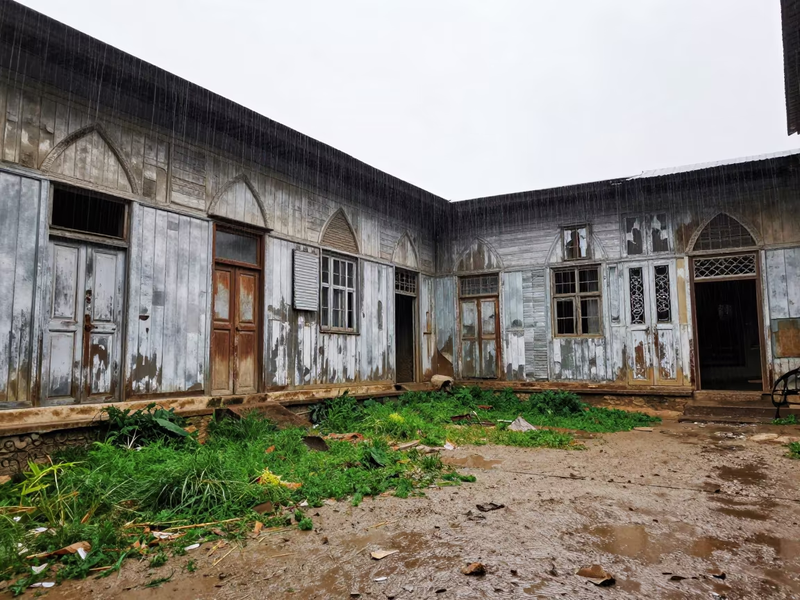 Rain-Washed Saloon Ruin in Baghdad Courtyard in through a courtyard reclaimed by grasses near Baghdad