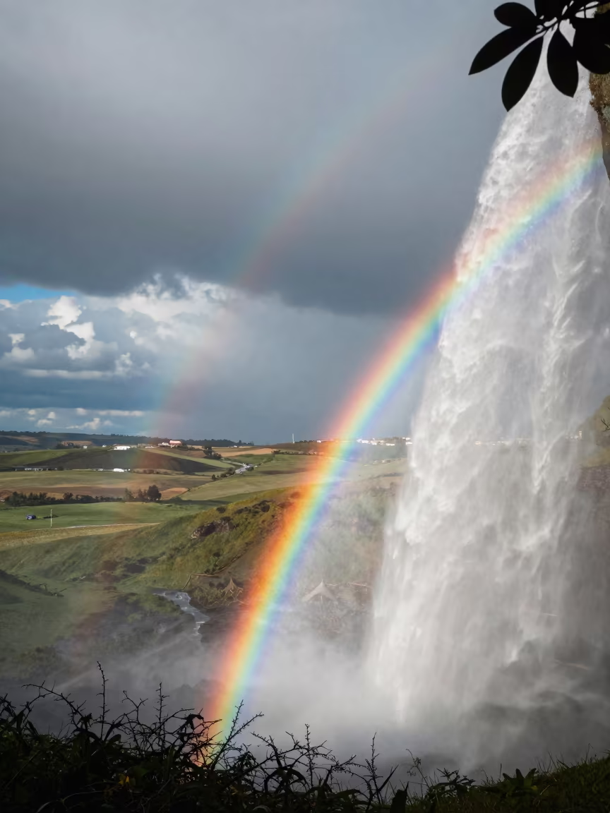 Rainbow in Waterfall Mist Over Georgia Thunderheads in over a horizon of stacked thunderheads in Georgia