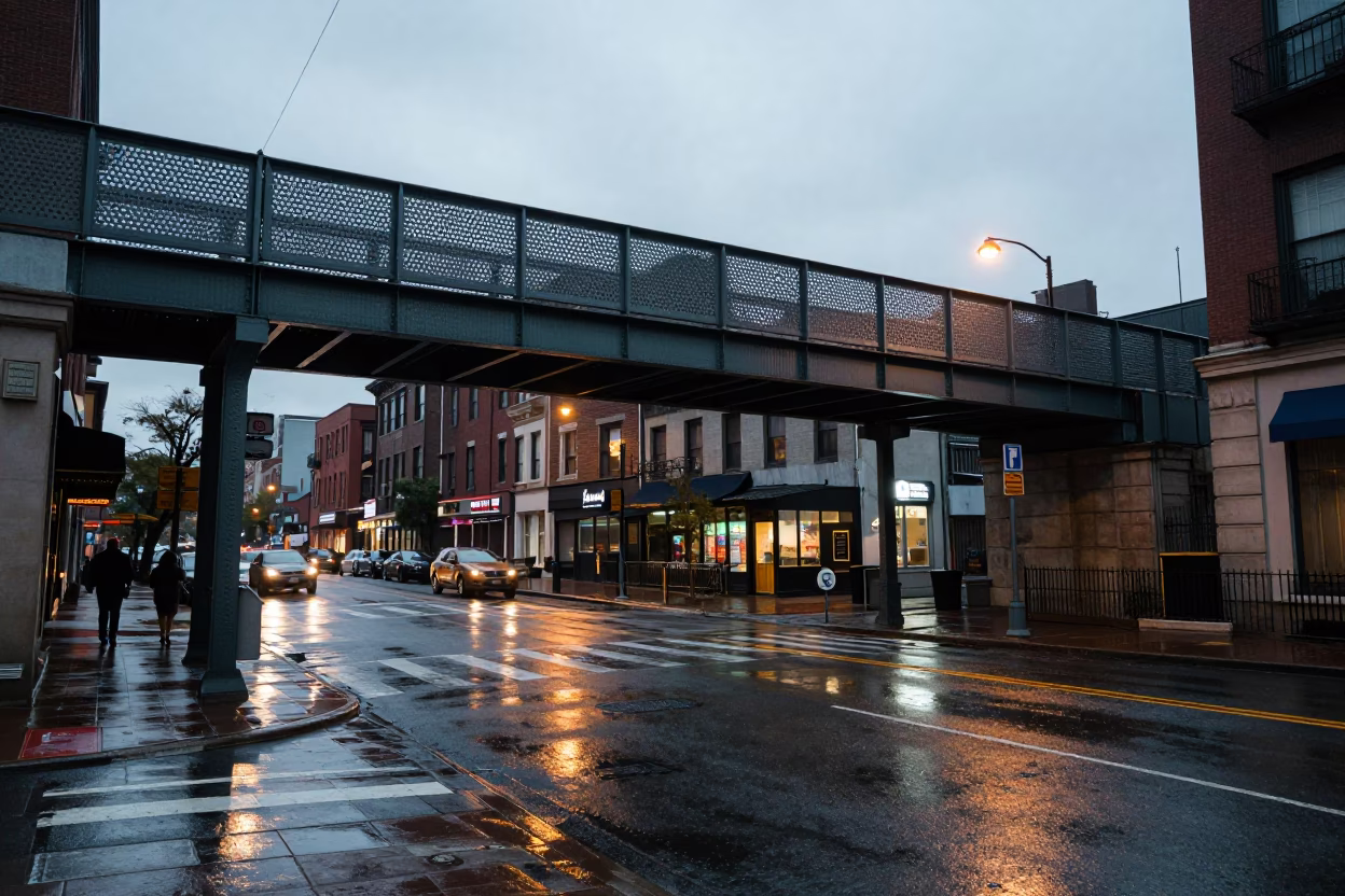 Rainy Early Evening Philadelphia Street Scene with Pedestrian Overpass and Wet Footsteps in in Philadelphia, Pennsylvania, United States