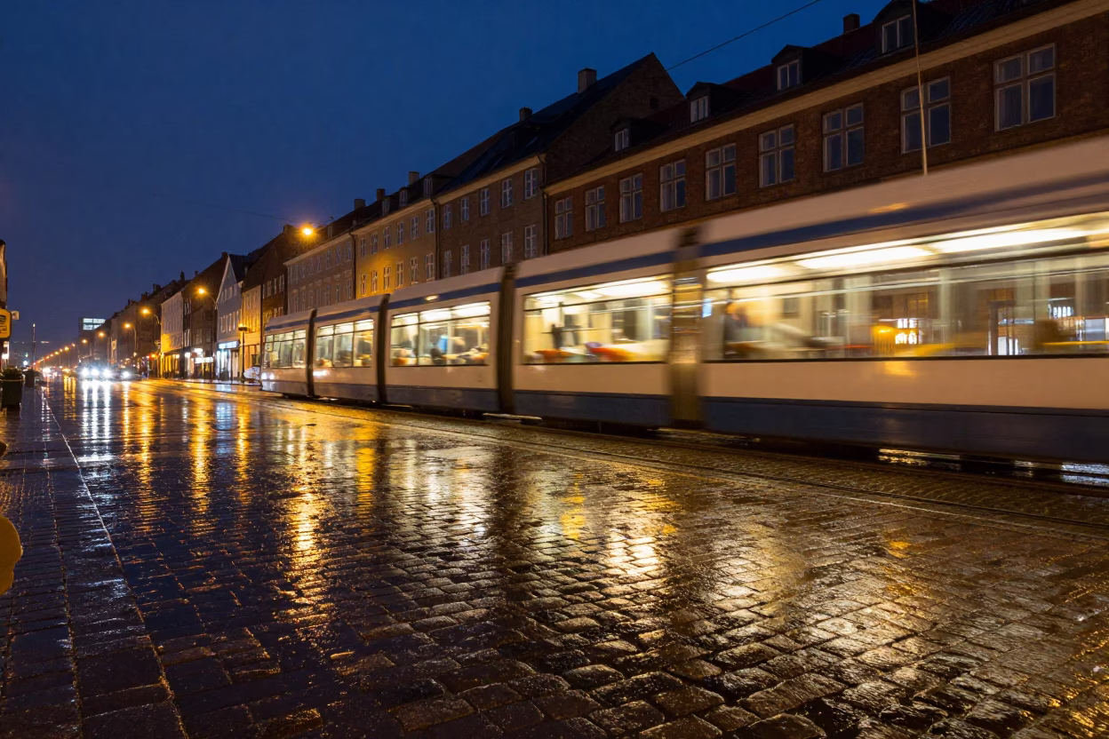 Rainy Night Copenhagen Tram Reflections on Cobblestones in in Copenhagen, Denmark