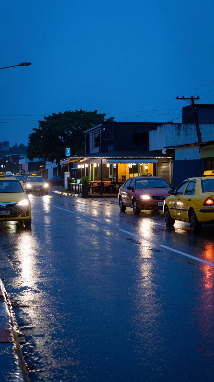 Rainy Twilight at Pointe-Noire Taxi Rank in outside a corner cafe in Pointe-Noire