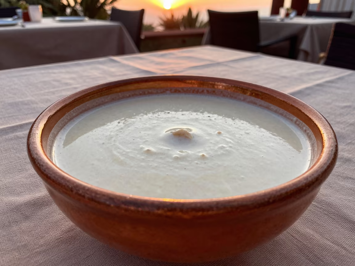 Ras Malai Bowl in Cardamom Milk Queretaro in on a linen-covered restaurant table in Queretaro